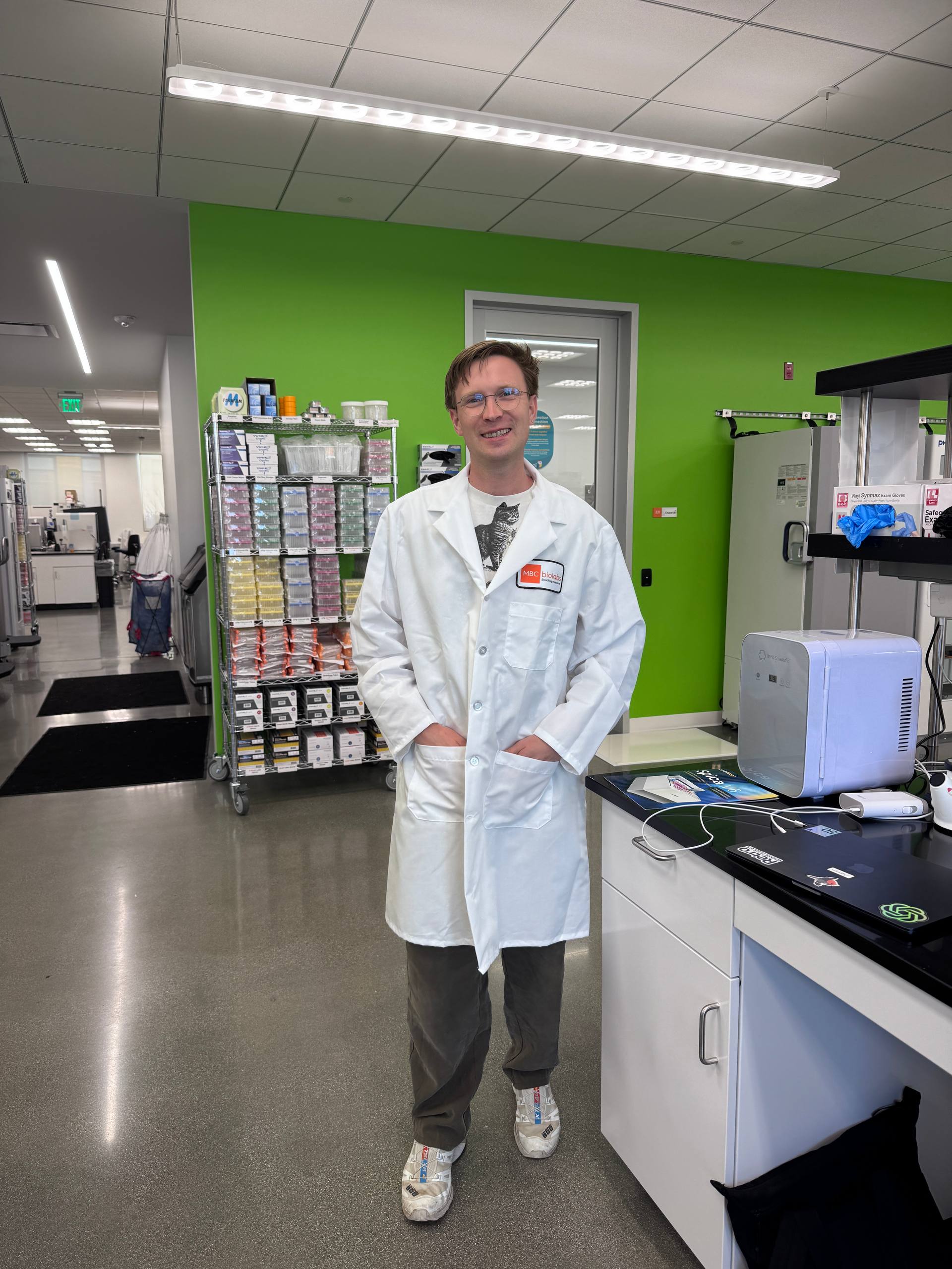 Andrei in a lab coat in the new wetlab