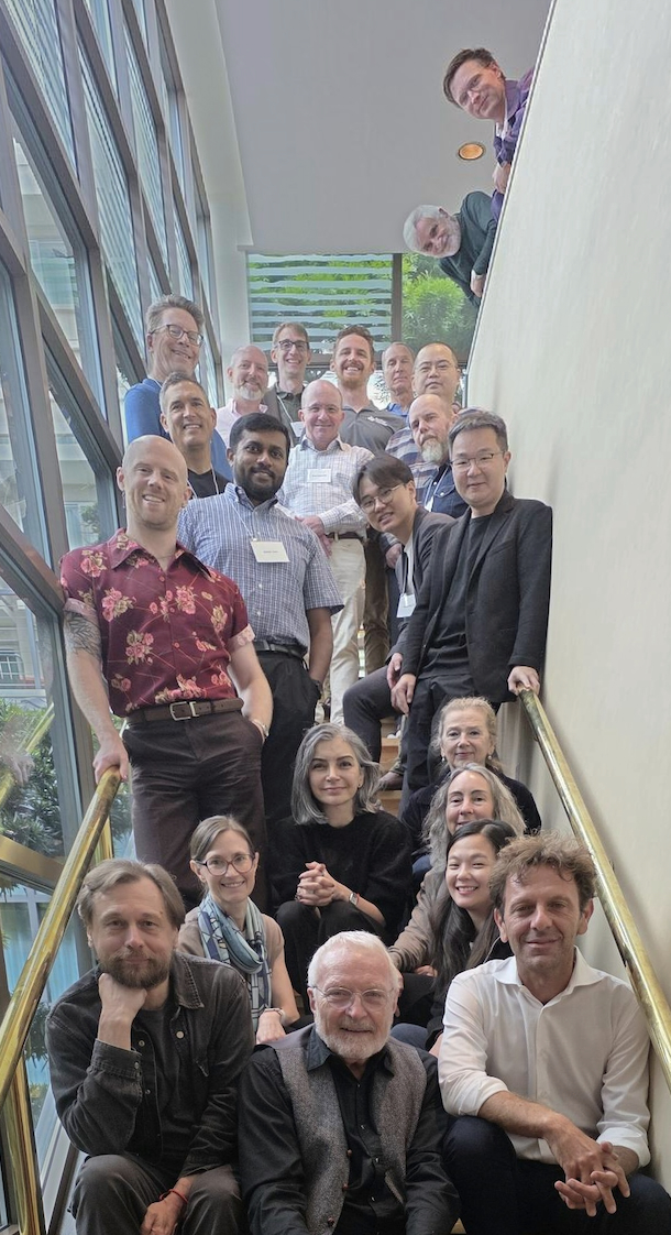 Participants of the Entropy and Aging symposium on a staircase